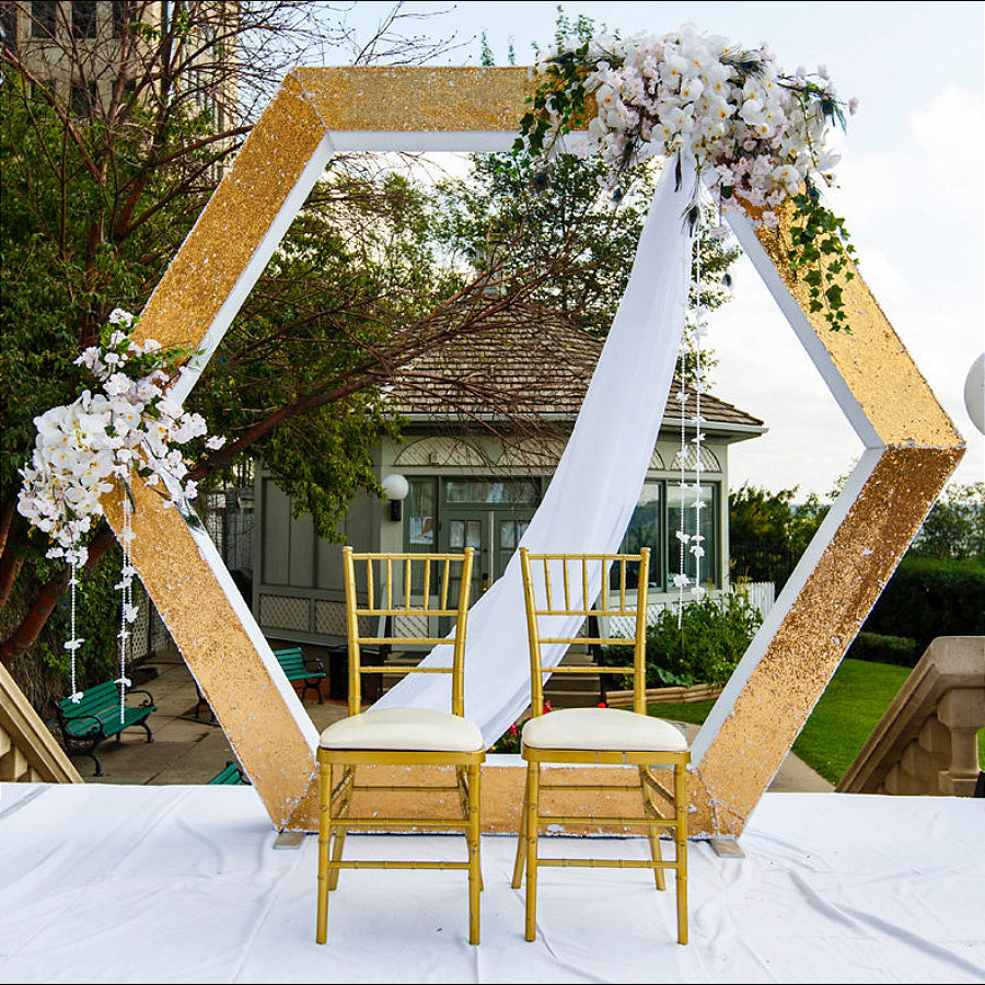Hexagon backdrop with flowers and drape